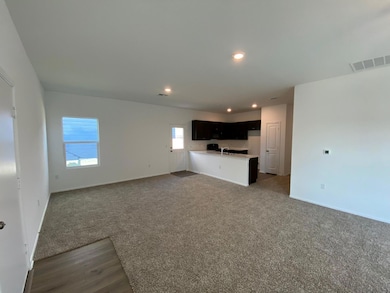 Unfurnished living room with recessed lighting an