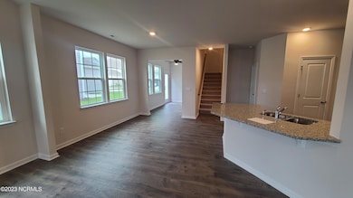 Living room view towards kitchen
