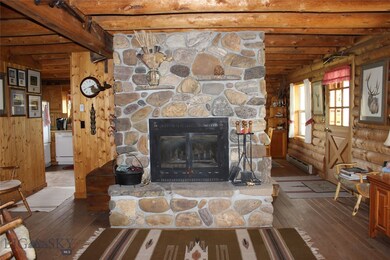 The floor to ceiling wood burning fireplace in the