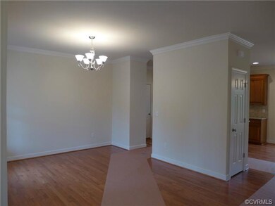 Formal dining room with hardwood floors and crown 