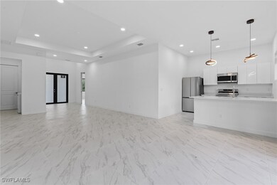 Unfurnished living room with visible vents, basebo
