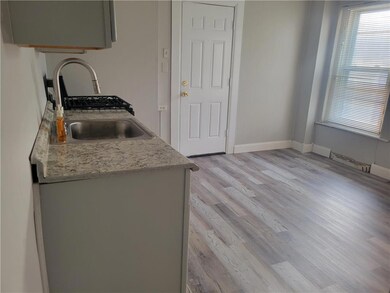 Another View of Kitchen (new back door leads to pa