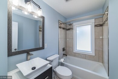 Modern looking main hallway bathroom. Gorgeous col