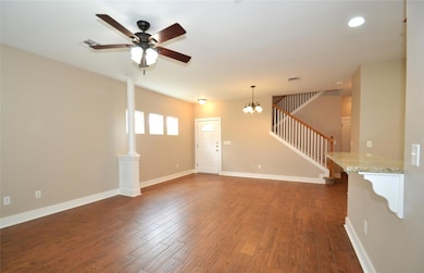 Spare room with stairs, baseboards, recessed ligh