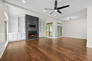 Unfurnished living room with a large fireplace, d