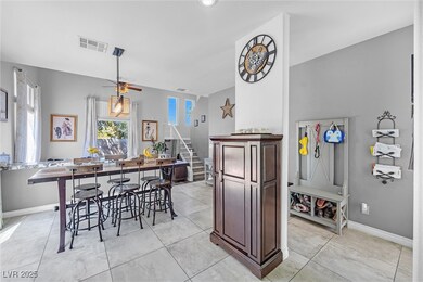 Kitchen with light tile patterned floors, baseboar