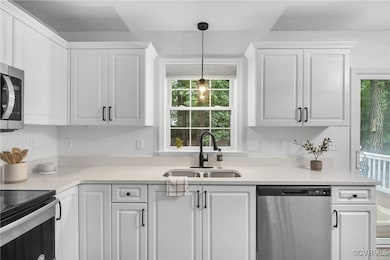 Kitchen with appliances with stainless steel finis