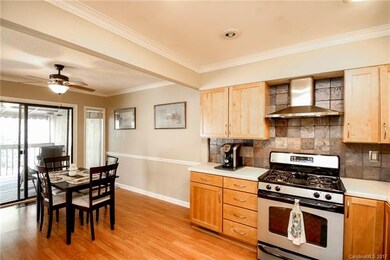 Kitchen Opens to Dining Area and Large Covered Dec
