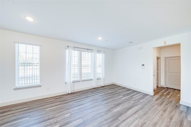 Unfurnished room featuring light wood finished floors and recessed lighting