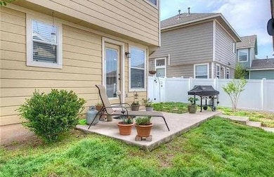 Back of property with a patio