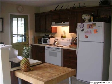 Large kitchen featuring eat in area and loads of cabinets