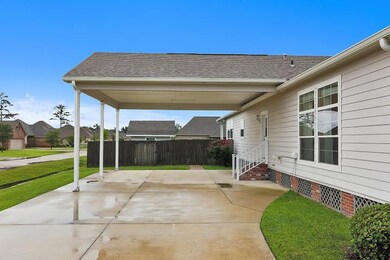 Extra wide two car covered carport with solid bric