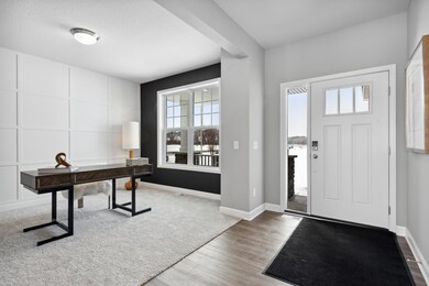 Located just off the foyer, this main level flex room provides endless opportunities; including a home office, formal dining area, an extra playroom or another sitting room. (Photo of decorated model, actual home's finishes may vary slightly)