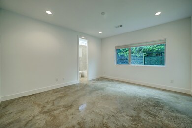 [First Floor Bedroom] Styled with stained concrete