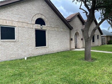 Entrance to property with brick siding