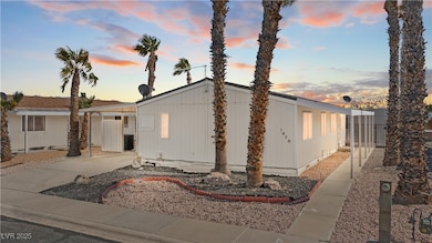 Manufactured home with driveway, attached carport,