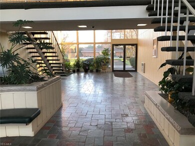 Lobby with sun filled windows looking to back of p