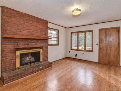 The den, with laminate flooring and fresh paint.