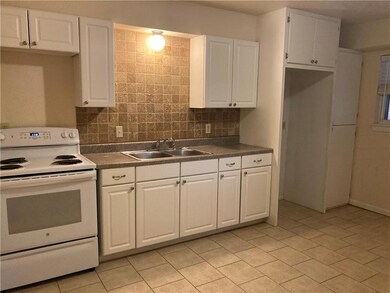 Kitchen with ample storage and tile backsplash