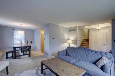 Family room is open to lovely dining area.
