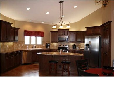 Granite countertops and a hidden walk-in pantry ma