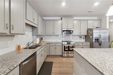 Kitchen featuring sink, light wood-type flooring, 