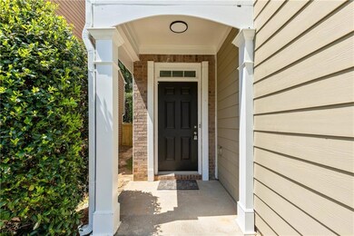 View of exterior entry with covered porch