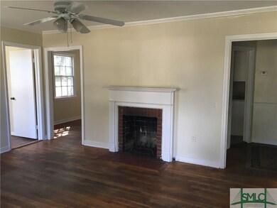 Living room features hardwood floor, fireplace and