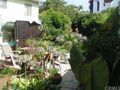 Rear garden & patio area separating the two reside