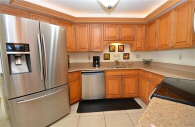 stainless appliances and tray ceiling