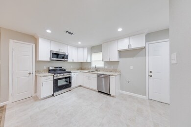 Bright and beautiful, this all-white kitchen is a