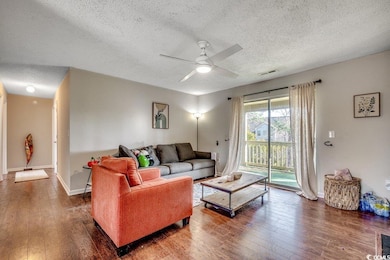 Living room with visible vents, baseboards, ceilin
