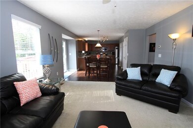 The family room is open to the eat in kitchen.