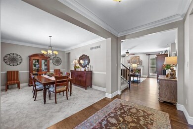 Foyer greets you with warm hardwood floors and cro