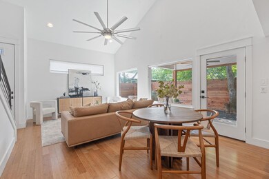 Dining room with high vaulted ceiling, ceiling fa