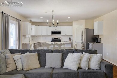 Open to the kitchen and dining room, this space is