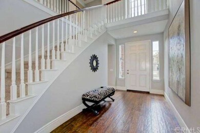Totally Today!  Sweeping staircase, wood floors an