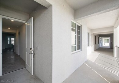 View of exterior entry featuring stucco siding