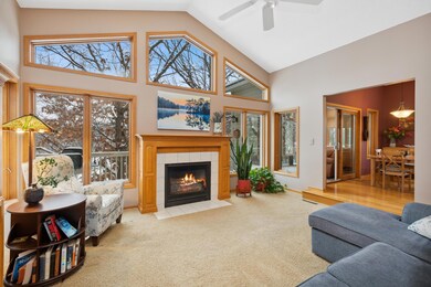 Massive vaulted ceilings with beautiful views of the backyard with the amazing, large windows and gas fireplace