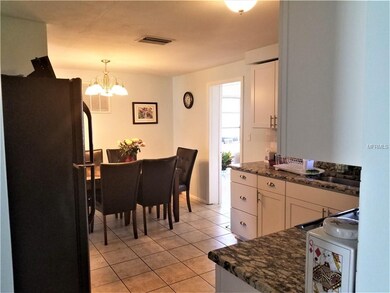 View of kitchen and dining area from the hallway
