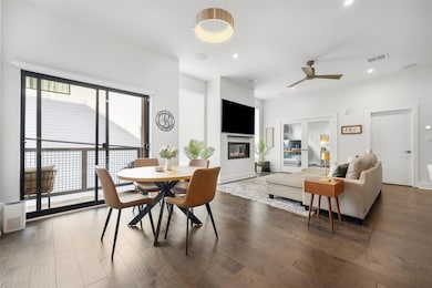 Dining room featuring dark hardwood floors and cei