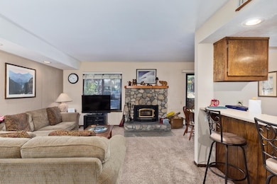 Living area featuring carpet floors and recessed lighting