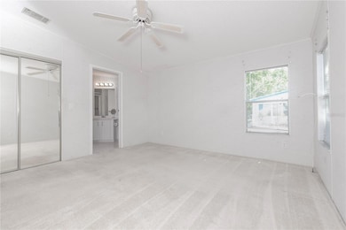 Primary bedroom with walk-in closet.