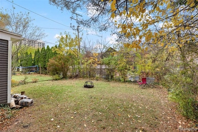 View of yard featuring a trampoline