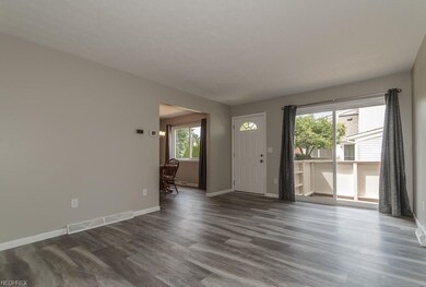 Open and airy living room with newer slider and fr