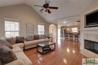Enter into the Great Room with wood floors, cathed