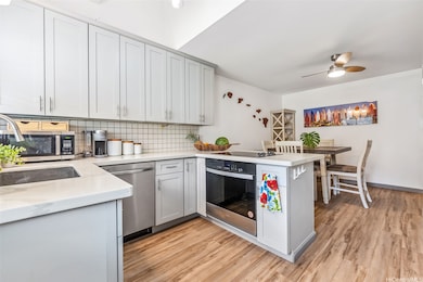 Step through this entry into a modern kitchen, refreshed with all-new appliances.