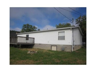 Exterior Back. Nice deck and room for a fire-pit i