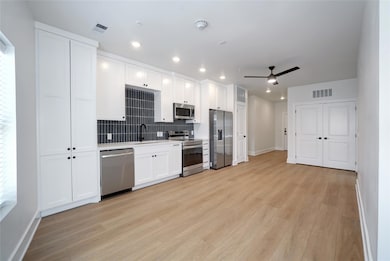 Kitchen featuring stainless steel appliances, a s