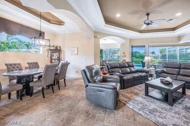 Living room featuring ceiling fan with notable cha